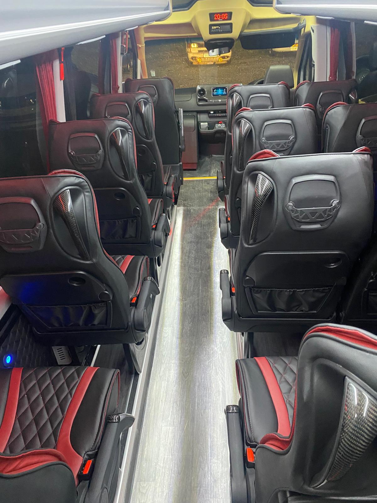 Executive minibus cabin with carbon-trim leather seats