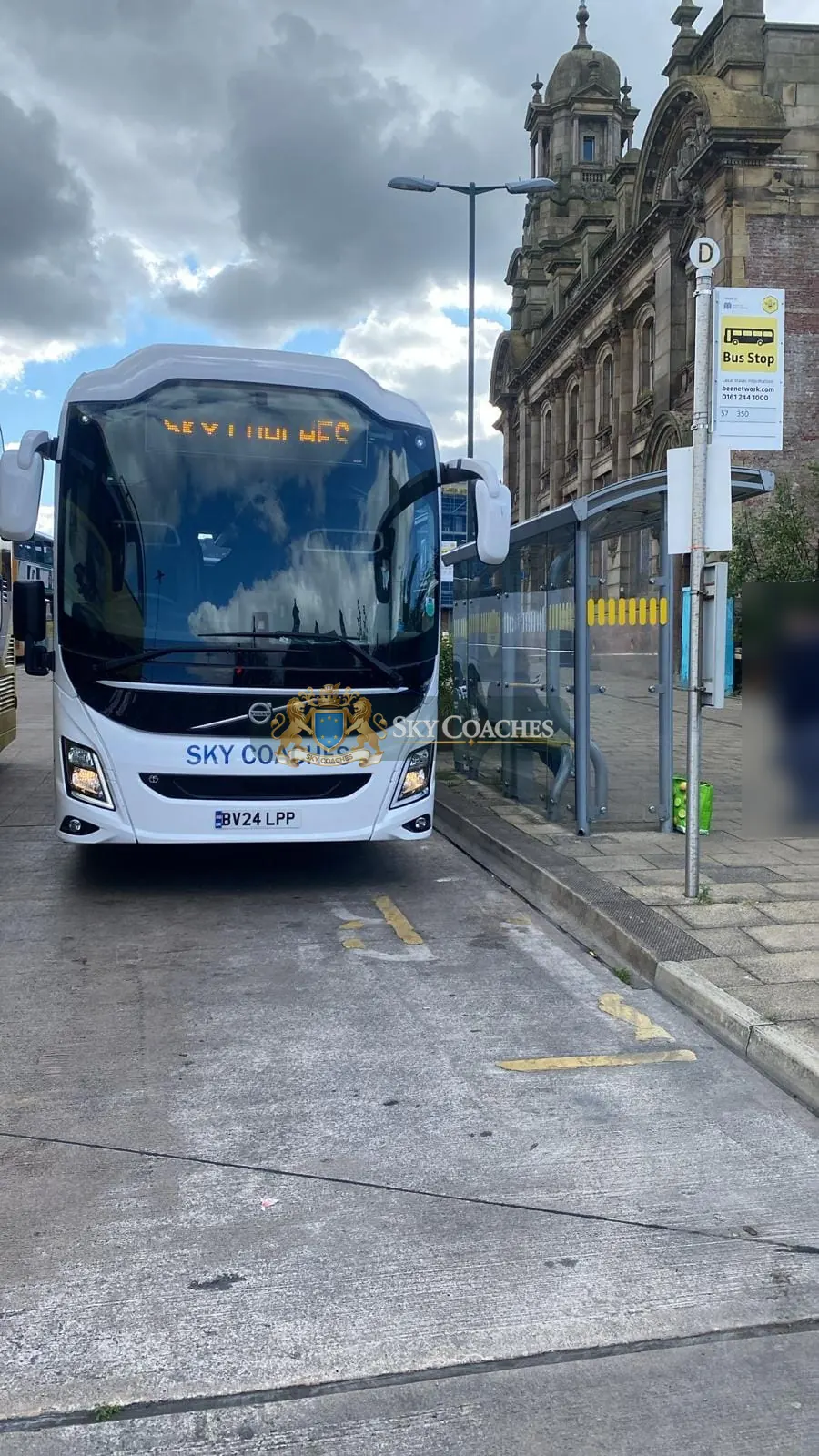 Sky Coaches Volvo coach at a city bus stop