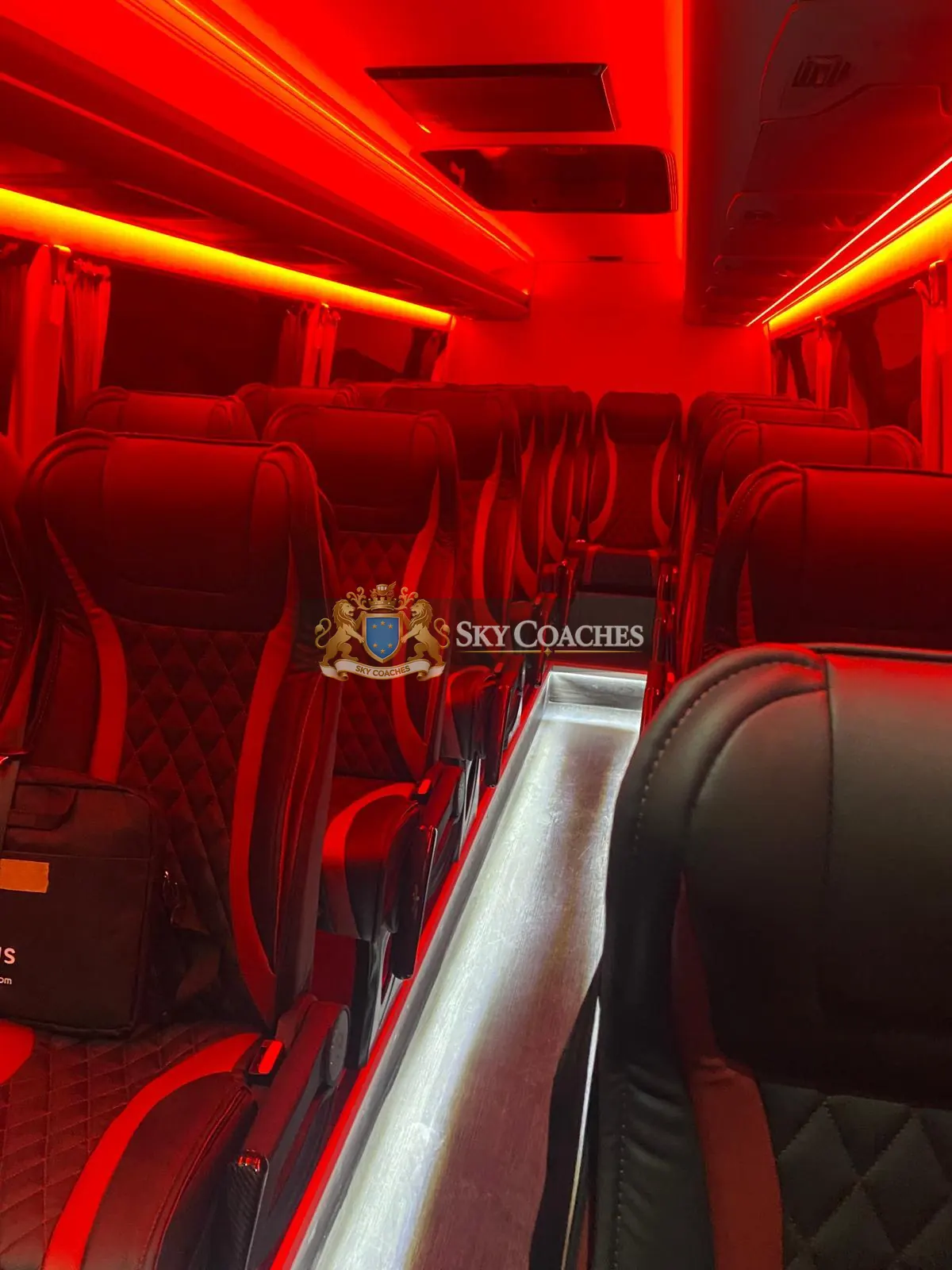 Luxury minicoach interior with red ambient lighting