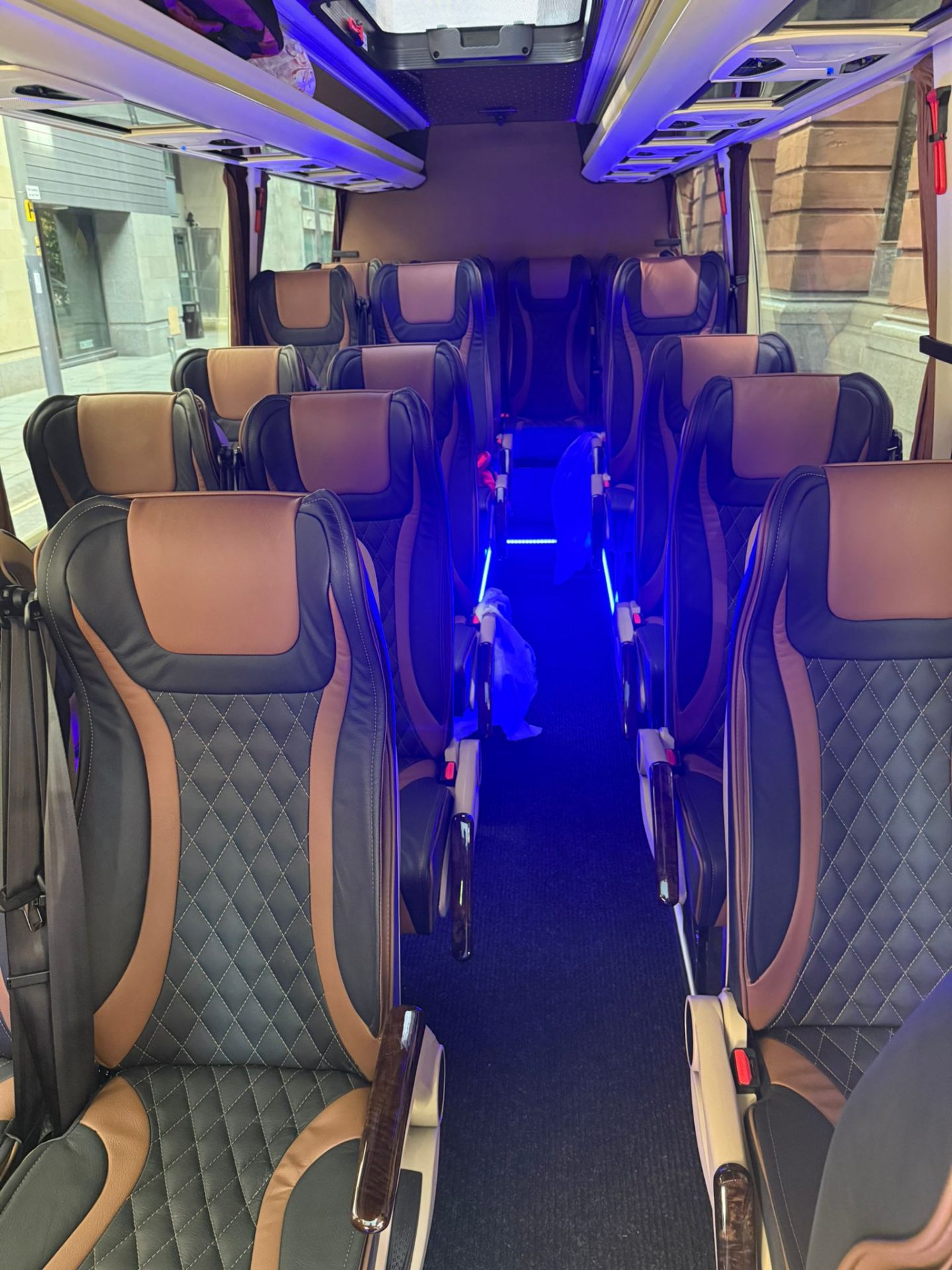 Executive minibus interior with blue ambient lighting